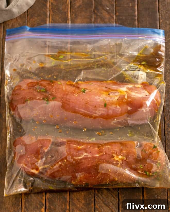 Pork tenderloin in a Ziploc bag with marinade.