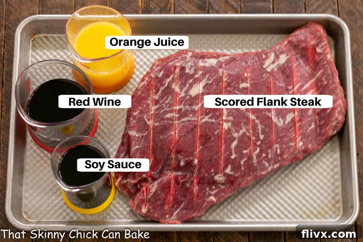 Flank Steak Marinade Ingredients on a sheet pan with labels, ready for mixing.