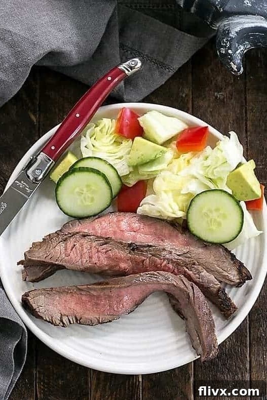 Process shot 2: Grilled flank steak resting on a cutting board, ready to be sliced.