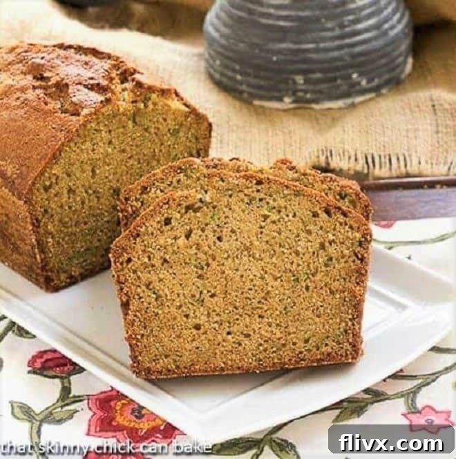 Sugar Crusted Zucchini Bread on a white tray, showcasing its golden-brown, caramelized crust and inviting texture.
