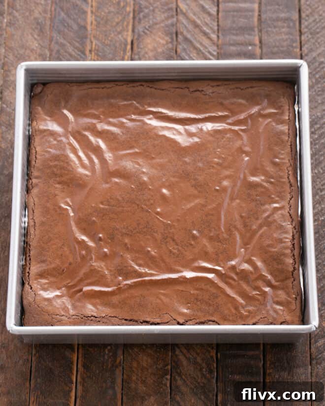 The assembled brownie layers baking in the oven.