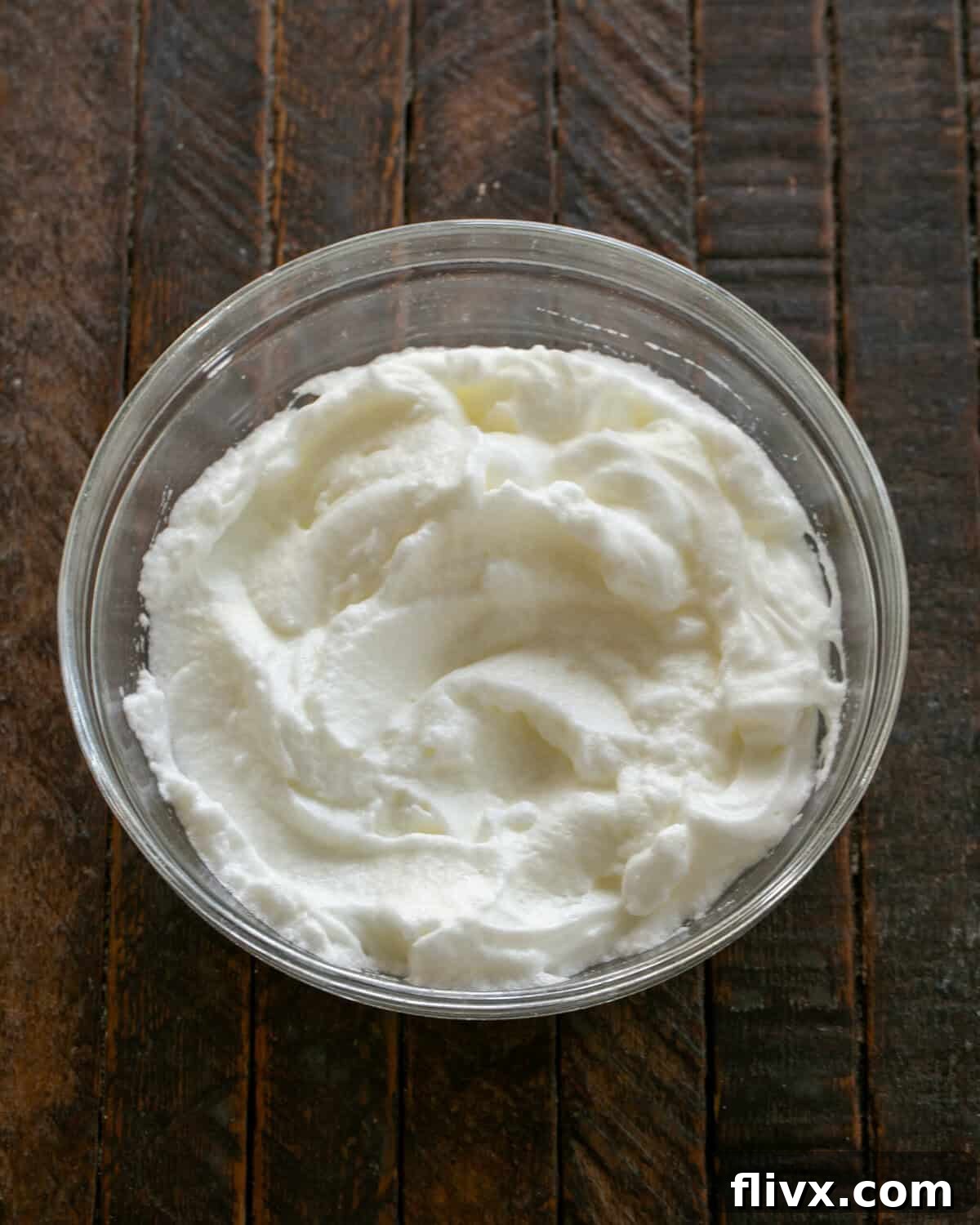 Step 1: Beat egg whites until stiff peaks form.