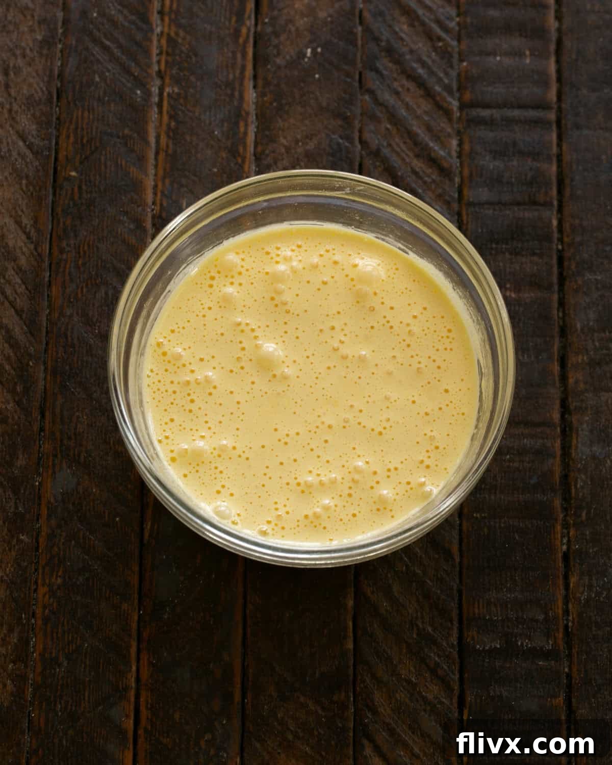 Step 2: Whisk egg yolks vigorously with sugar until pale and thick.