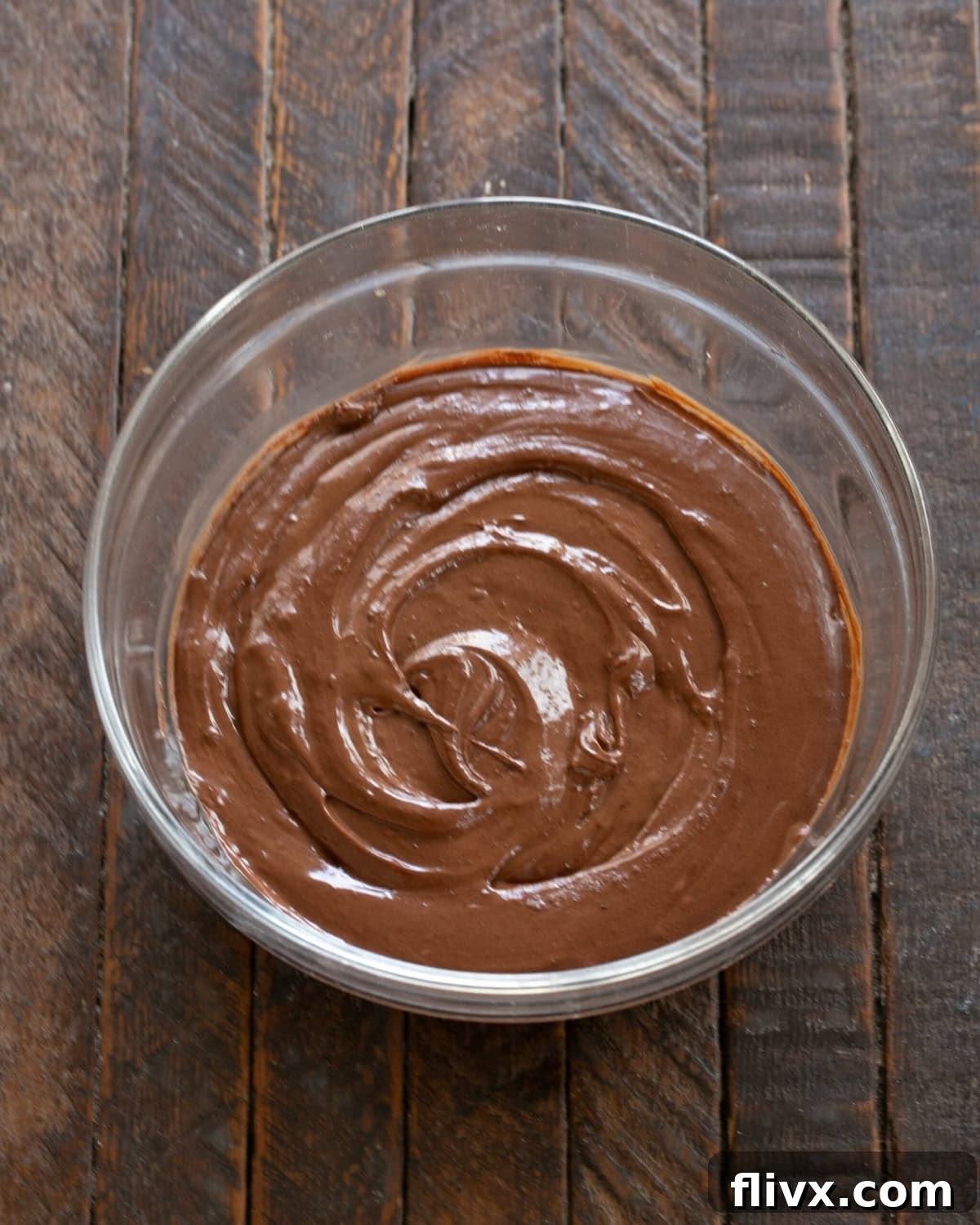 Step 4: Combine melted chocolate, orange liqueur (or coffee liqueur), and cream into the egg yolk mixture, creating a luscious chocolate base.