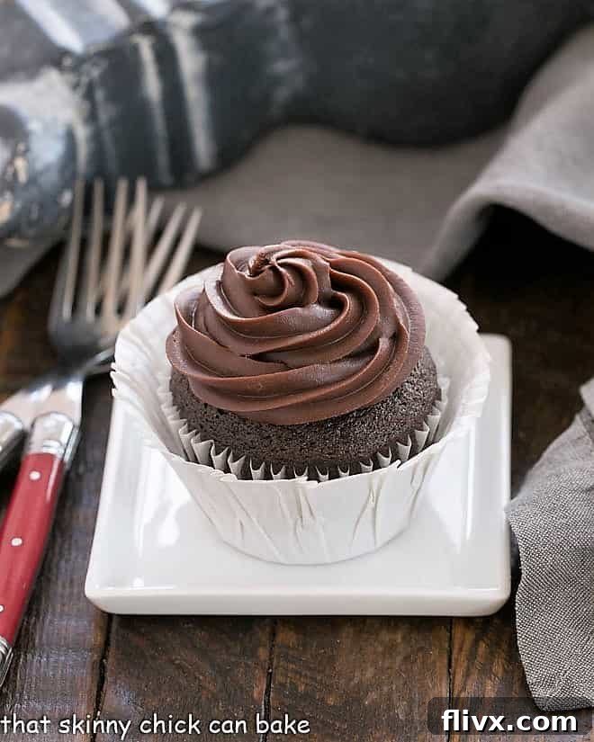 One chocolate blender cupcake on a square white plate, showcasing its rich color and frosting.