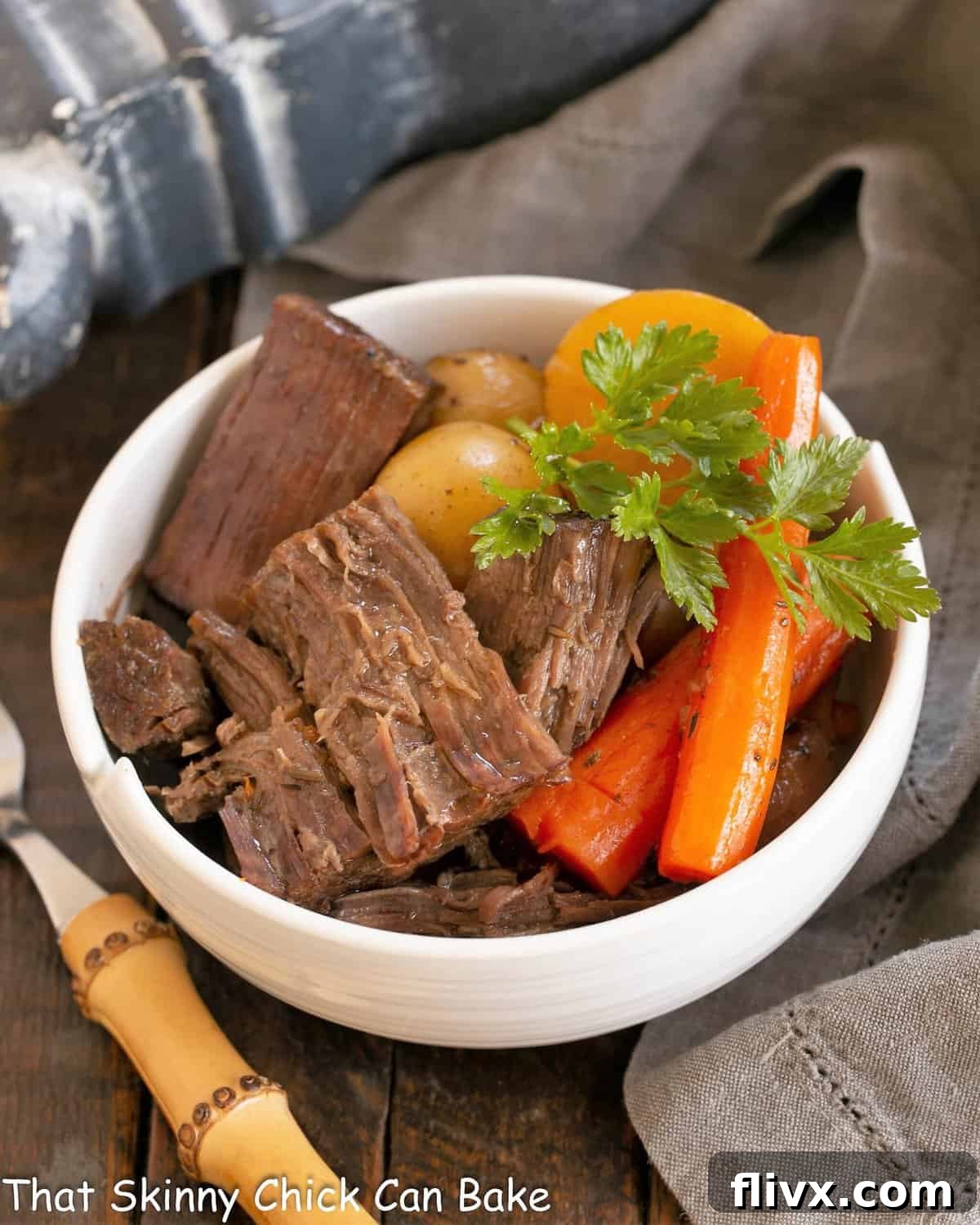 Pot roast garnished with parsley in a white bowl.