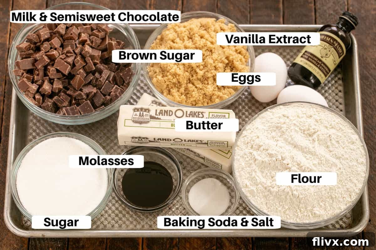 Arrangement of Ad Hoc Chocolate Chunk Cookie ingredients, including flour, sugars, eggs, cold butter, and two types of premium Valrhona chocolate, laid out on a clean metal sheet pan.