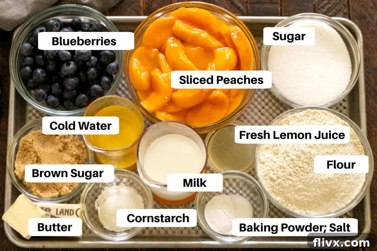 Peach Blueberry Cobbler Ingredients neatly arranged with labels on a sheetpan, showcasing freshness and quality.