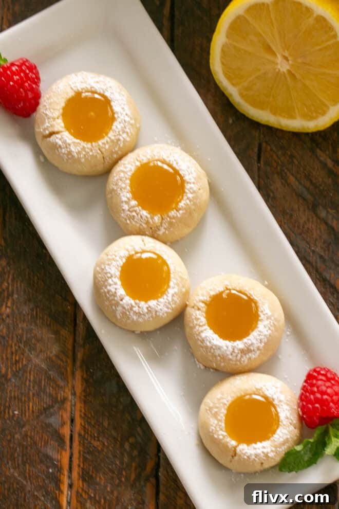 Overhead view of lemon thumbprints on a white tray w/o watermark.