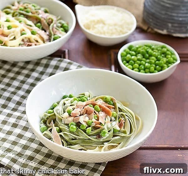A close-up of Straw and Hay Pasta served in a white bowl, resting on a green and white checkered napkin, garnished with fresh parsley.
