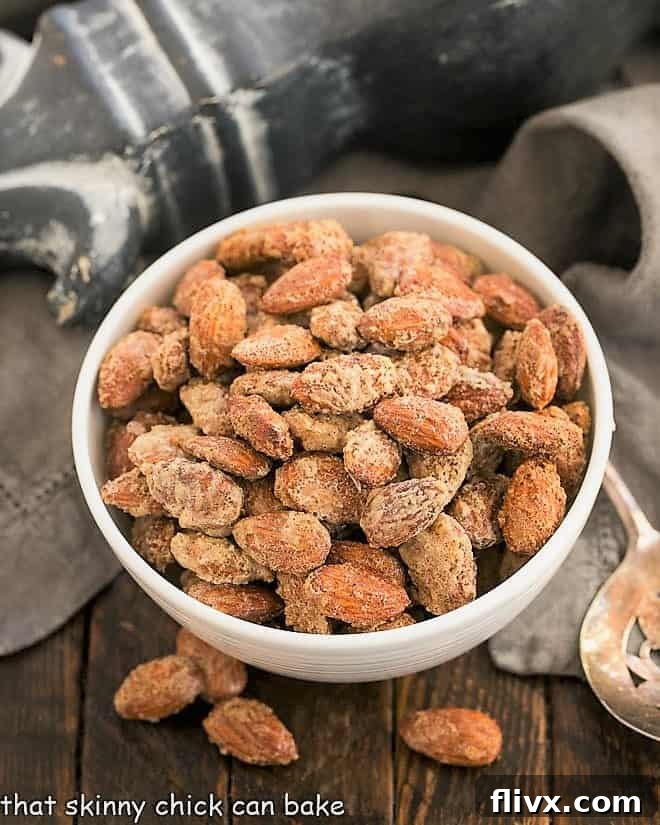 Overhead view of vanilla almonds in a white serving bowl, ready to be enjoyed.