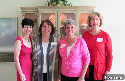 Bridal shower hostesses posing happily