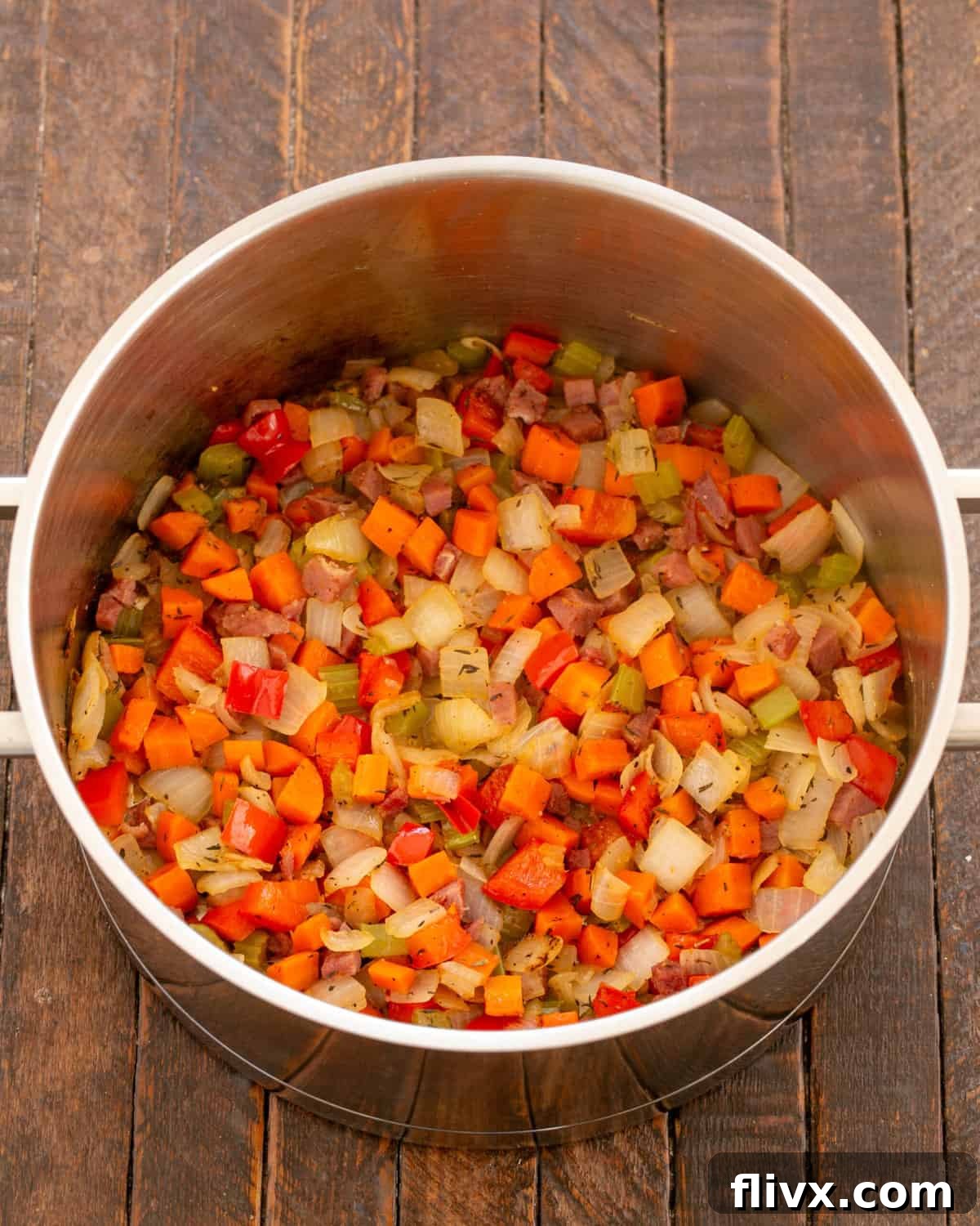 The heat has been turned off, and the tender aromatics are resting in the pan.