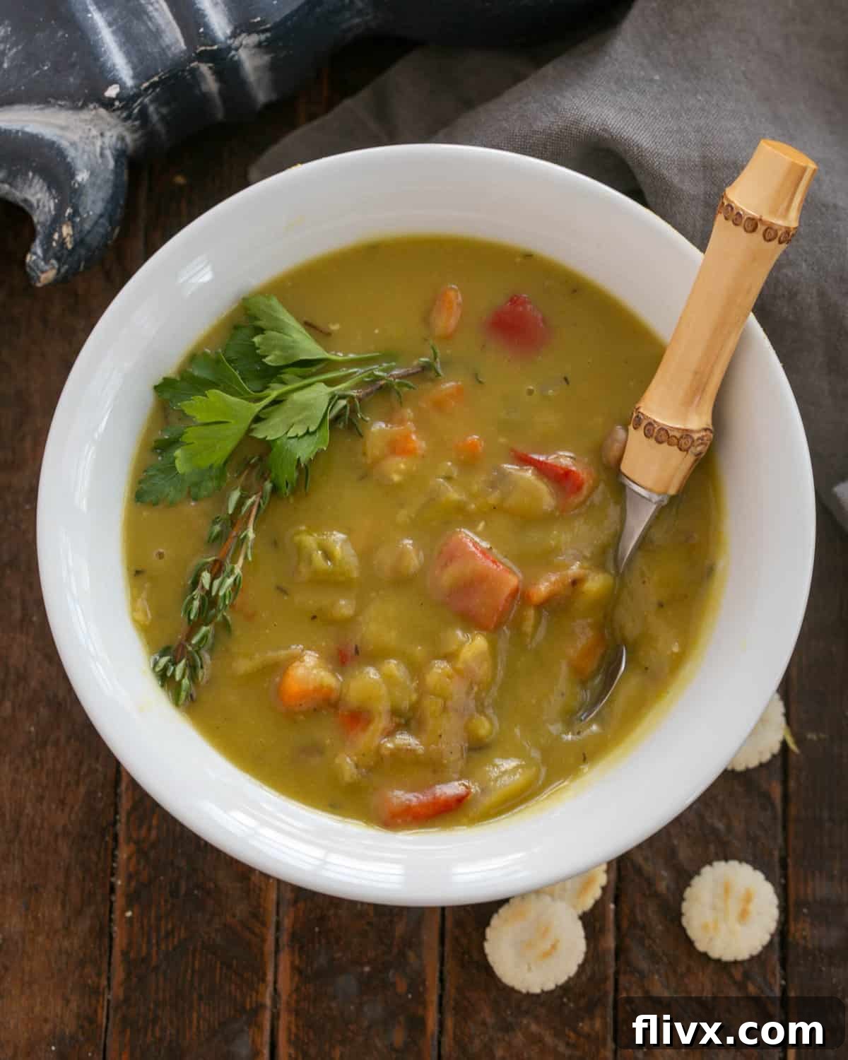 Simmering the finished split pea and ham soup until hot and ready to serve.
