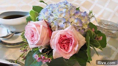 A lovely bouquet of fresh flowers in a glass vase, perhaps to celebrate a successful bake