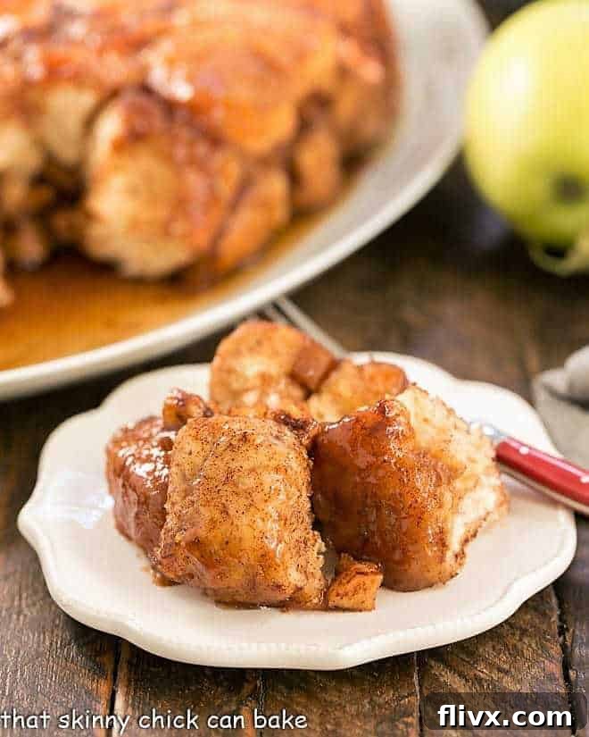 Gooey Apple Monkey Bread on a small white plate, ready to be enjoyed.