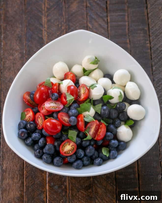 Salad ingredients ready to toss with dressing.