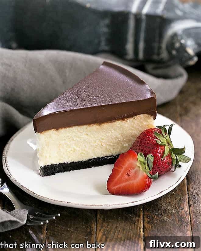 A rich Ganache Topped Cheesecake with a smooth chocolate ganache layer over creamy vanilla cheesecake.