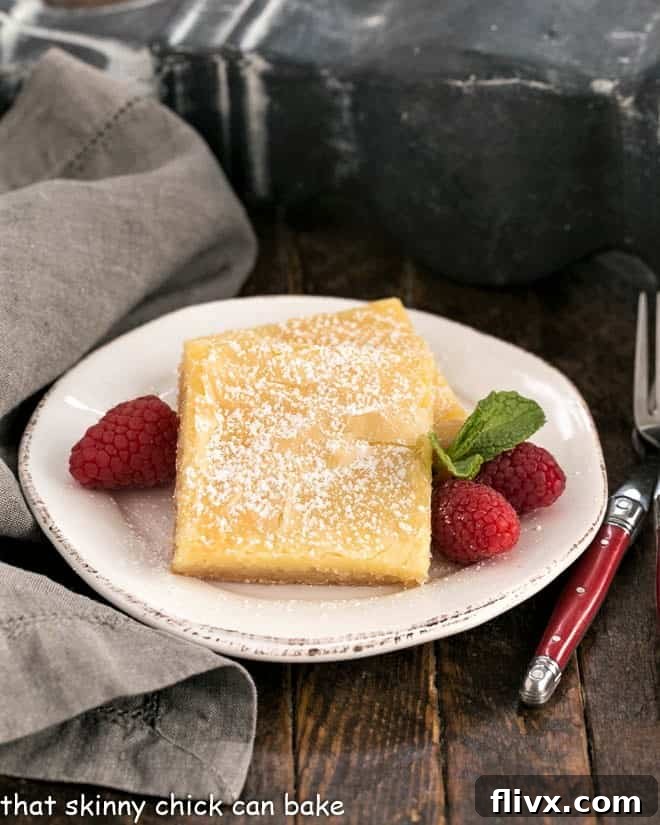 Golden-brown Gooey Butter Cake from Scratch with a dusting of powdered sugar.