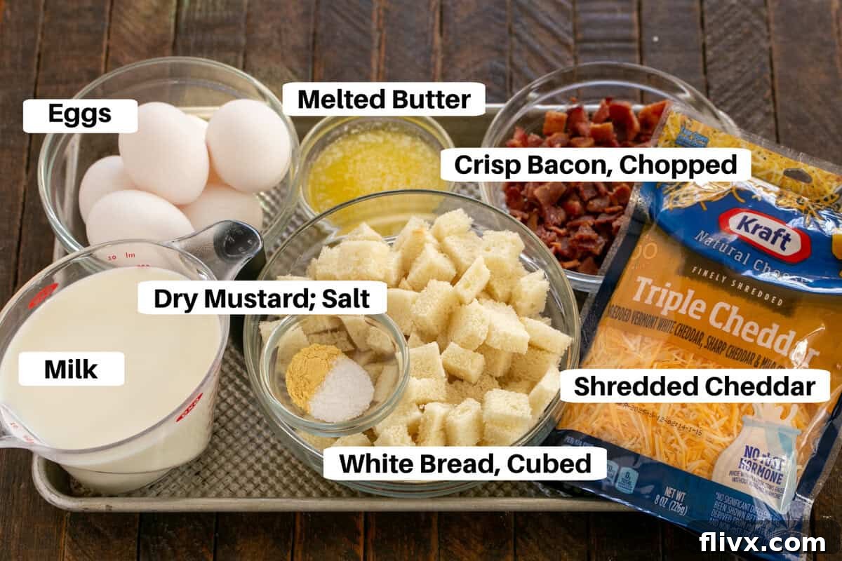 Overnight breakfast casserole ingredients laid out on a sheet pan with labels, ready for preparation.