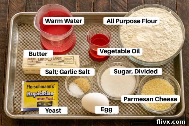 Homemade Breadsticks Ingredients with labels on a sheetpan.