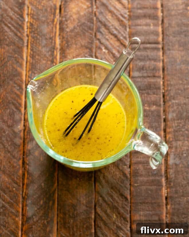 Step 1: Whisking together dressing ingredients in a small bowl.