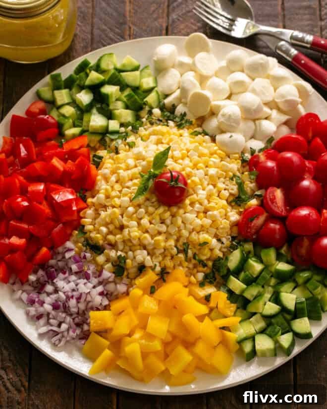 Step 2: Chopping various fresh vegetables like tomatoes, bell peppers, and cucumbers on a cutting board.