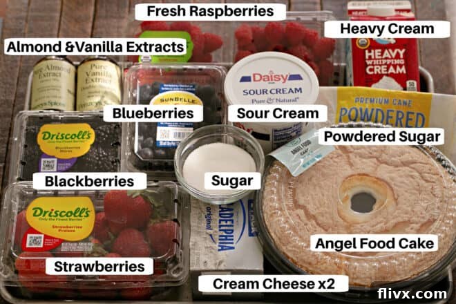 Berry trifle ingredients laid out neatly on a sheet pan with labels, illustrating all components required for preparation.