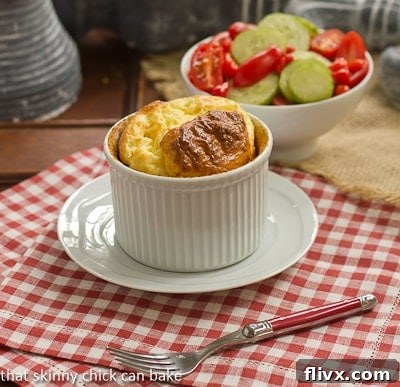 Pillowy Muenster Soufflés 2 Muenster_Soufflé in a white ramekin on a white saucer.