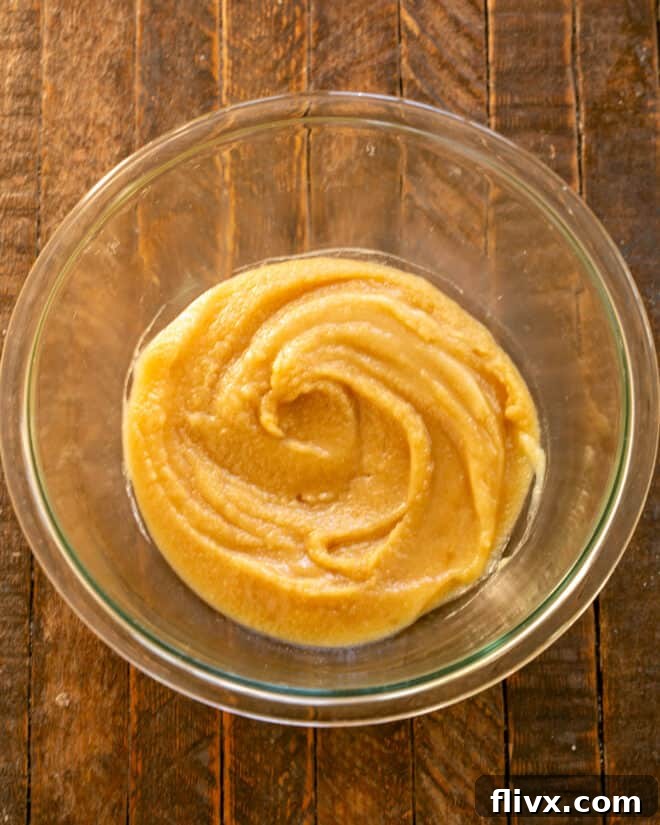 Melted butter and both granulated and brown sugars combined in a separate bowl, beaten until smooth and creamy.