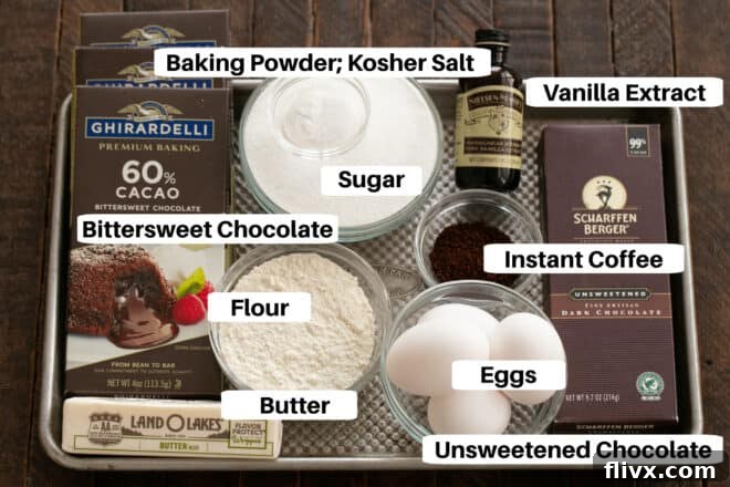 A collection of Double Chocolate Cookie ingredients are neatly laid out on a sheet pan, each with a clear label. The setup is clean, organized, and ready for baking, showcasing the quality components needed for these rich, fudgy chocolate cookies.