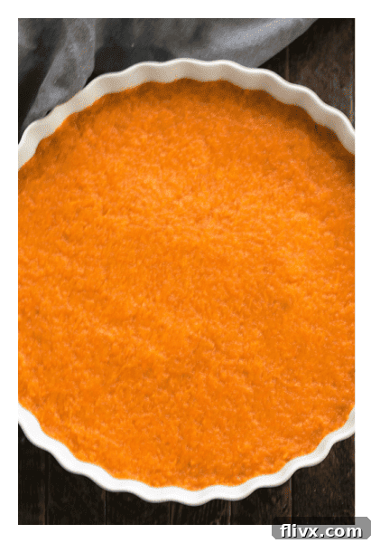 Sweet Potato Casserole filling in a baking dish before topping.