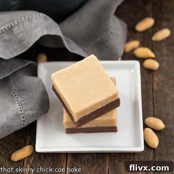 Two slices of Layered Chocolate Peanut Butter Fudge on a square white plate