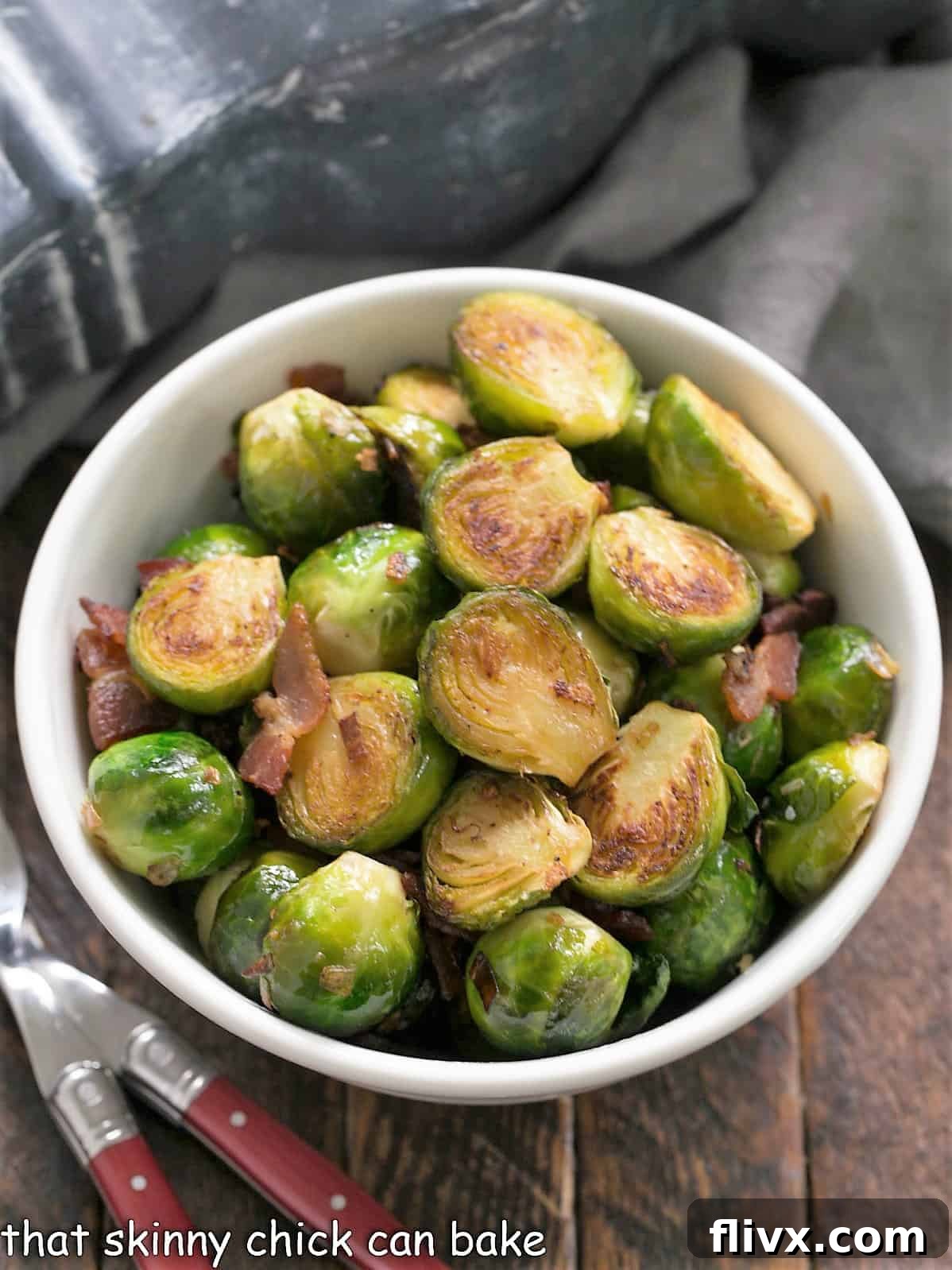 Overhead view of a bowl of sauteed brussels sprouts with bacon