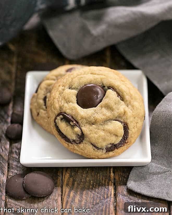 Southern Living's BEST Chocolate Chip Cookies on a square white plate, showcasing their inviting texture and rich chocolate.