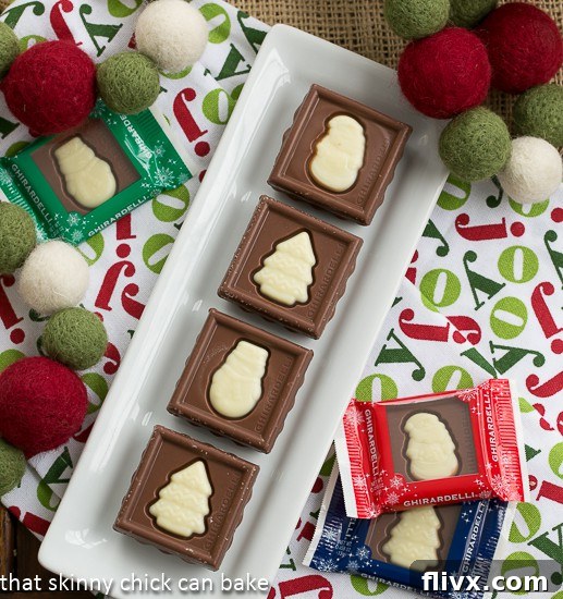 Festive Fudge Snowflakes and Squares on a white ceramic tray.