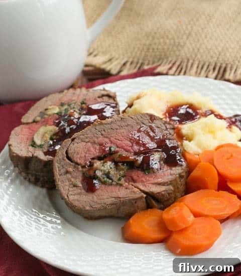 Gourmet Gorgonzola Mushroom Stuffed Beef Tenderloin on a serving platter, ready for a special occasion.