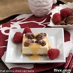 A slice of caramel pecan cheesecake bars