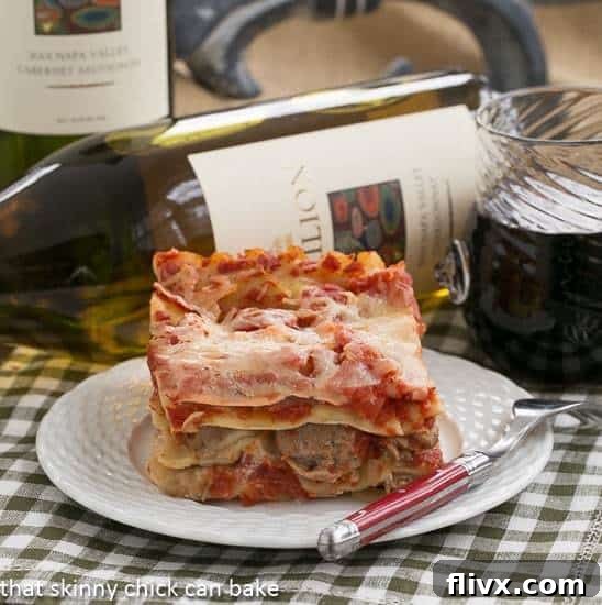 Slice of Easy Sausage and Mushroom Lasagna on a white plate, showcasing rich layers and golden cheese.