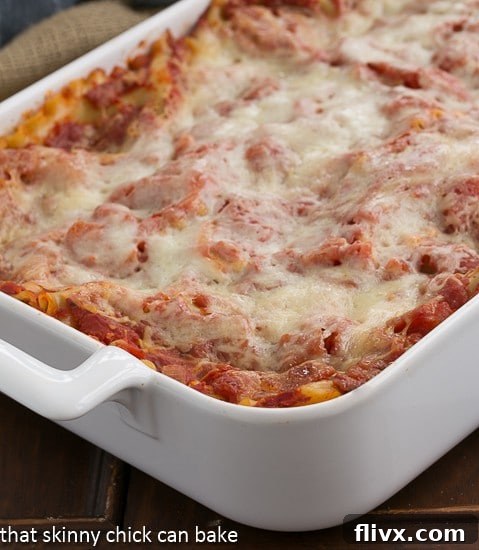 Close-up of a pan of Easy Sausage and Mushroom Lasagna, ready to be served, showing the golden-brown top and bubbling sauce.