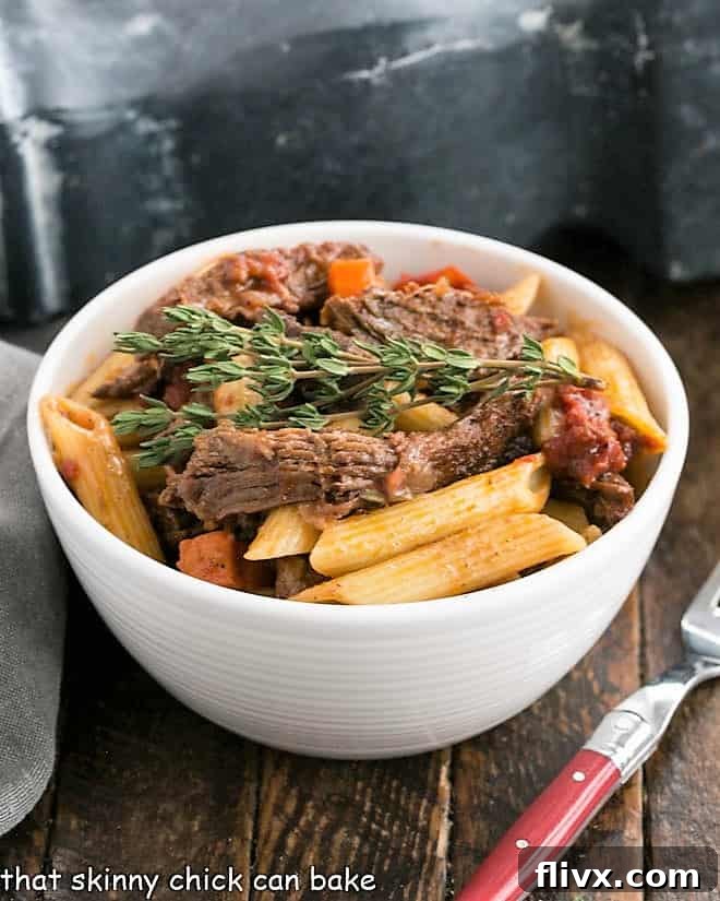 Hearty Beef Ragu pasta in a white bowl, ready to serve.