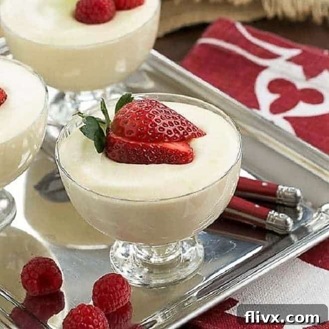 Dreamy White Chocolate Mousse spiked with Frangelico in glass dishes topped with berries