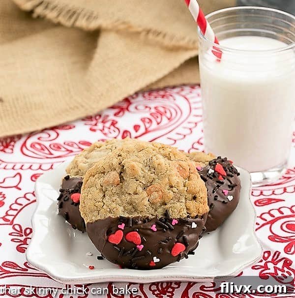 Big Dipper Oatmeal Butterscotch Cookies elegantly arranged on a square white plate, with a tall glass of milk in the background.