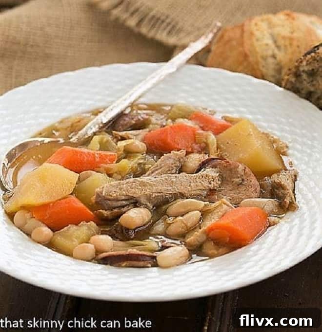 A bowlful of French Garbure Stew, showcasing its rich, chunky texture and vibrant ingredients.
