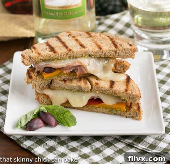 A stunning Mediterranean Grilled Cheese sandwich, golden-brown and perfectly melted, presented for a gourmet experience.