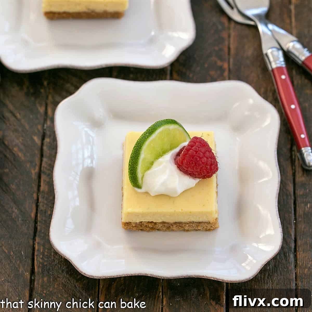 Overhead view of a key lime pie bar with a dollop of whipped cream, slice of lime and raspberry to garnish, perfect for a book club.
