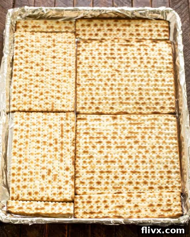 Layer Matzo on a rimmed sheet pan, ensuring a single, even layer for optimal caramelization.