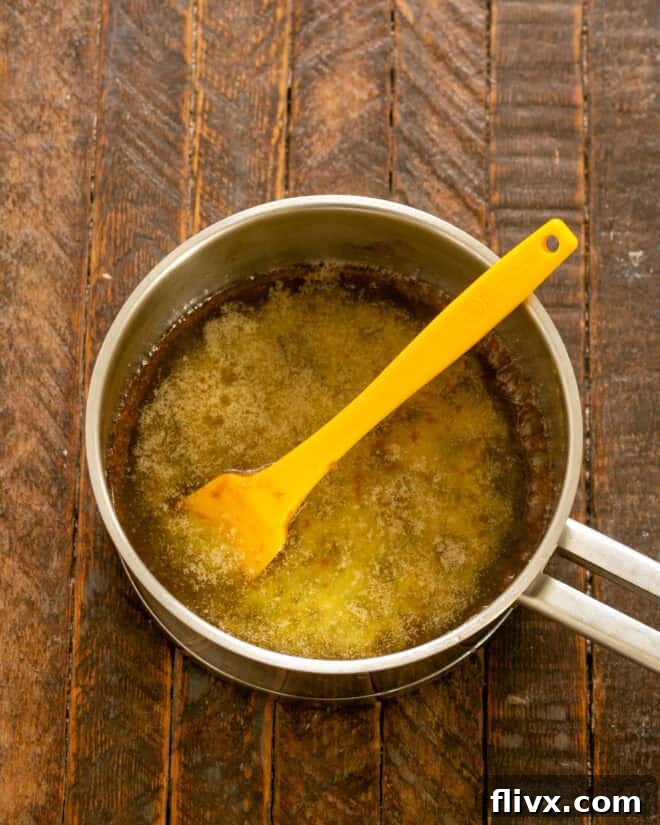 Boil butter and brown sugar together for exactly 3 minutes, creating a rich caramel base.