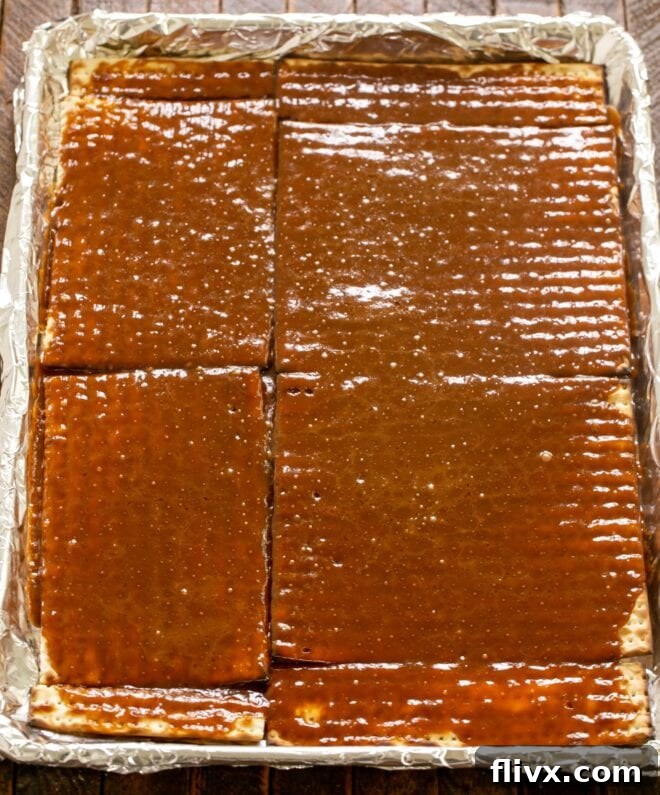 Step 4 in making Matzo Toffee: baking until the caramel is bubbling and golden.