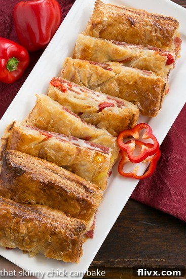 Close-up of freshly baked Puff Pastry Antipasto Squares, golden brown and ready to serve, highlighting the delicious filling